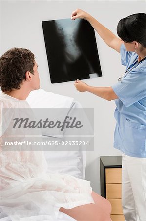 Female doctor examining an X-Ray report