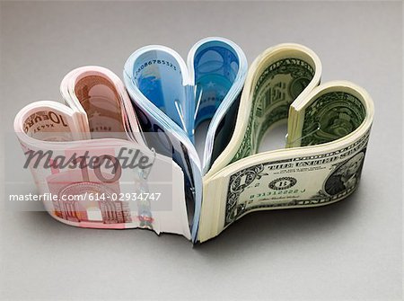 Banknotes in heart shapes Banknotes in heart shapes
