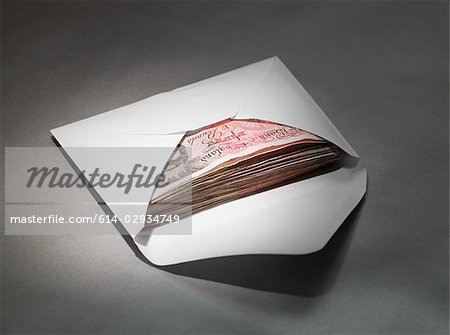 Fifty pound notes in an envelope