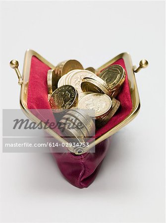Pound coins in a purse Pound coins in a purse