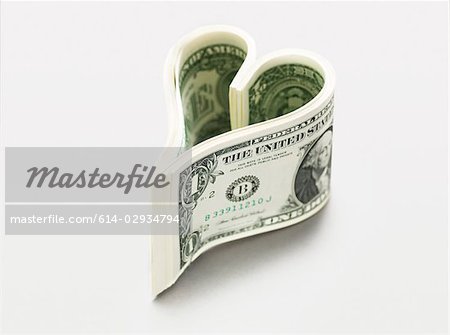 Dollar bills in heart shape Dollar bills in heart shape