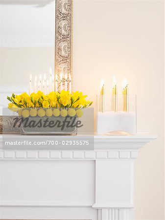 Modern Menorah and Candle Arrangements on Fireplace Mantel