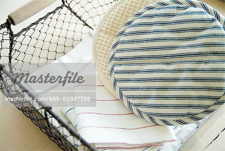 Oven mitts and towels in basket