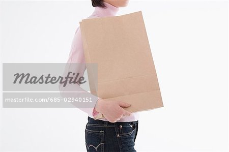 Woman holding paper bag