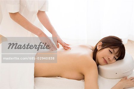 Young woman having body massage