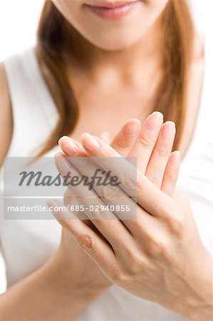 Young woman rubbing hands