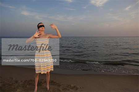 Blindfolded Woman on the Beach