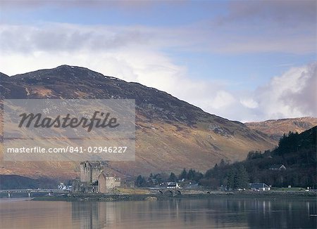 Eilean Donan castle reflected in the calm water of Loch Duich from Totaig, Dornie, Highland region, Scotland, United Kingdom, Europe