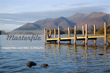 Wooden jetty at Barrow Bay landing on Derwent Water looking north to Skiddaw in autumn, Keswick, Lake District National Park, Cumbria, England, United Kingdom, Europe