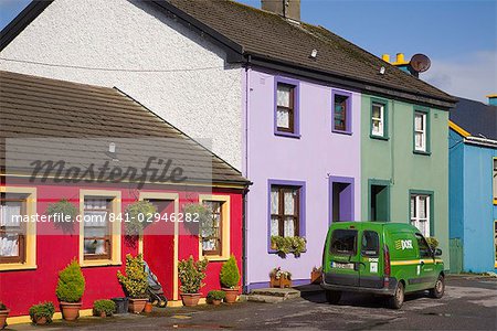 Green post van outside colourful houses in main street of historical village on Ring of Beara tourist route, Eyeries, Beara Peninsula, County Cork, Munster, Republic of Ireland, Europe