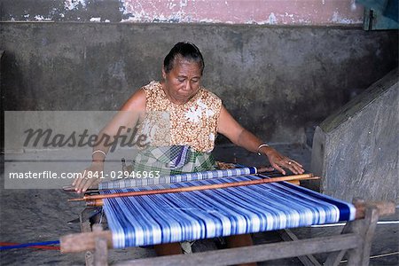 Woman weaving ikat cloth, Lamalera Island, Indonesia, Southeast Asia, Asia