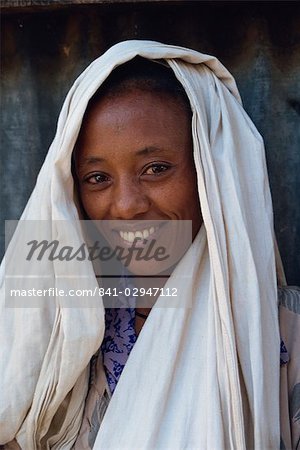 Head and shoulders portrait of woman, smiling and looking at the camera, Ethiopia, Africa