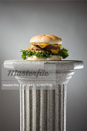 cheeseburger on a pedestal
