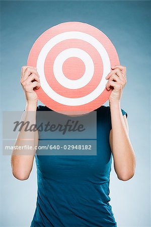 woman holding up a target