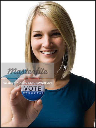 woman with a "vote" button