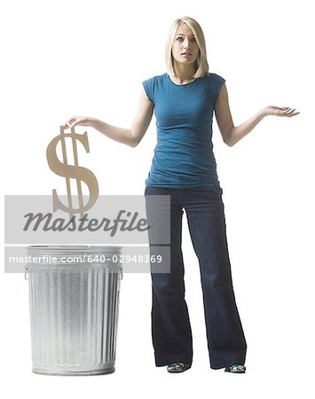 woman throwing dollar symbol in the trash
