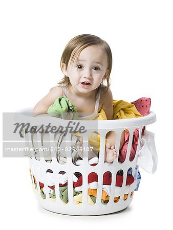 baby girl in a laundry basket