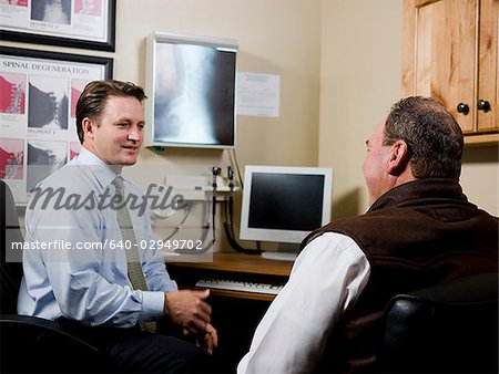 man at chiropractor's office