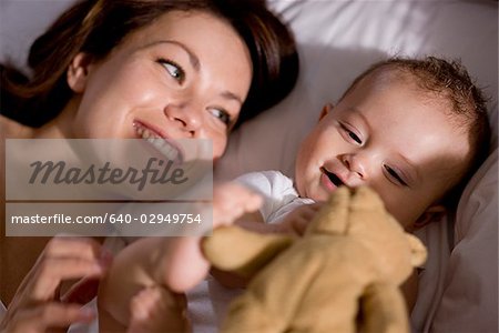 mother and baby in bed