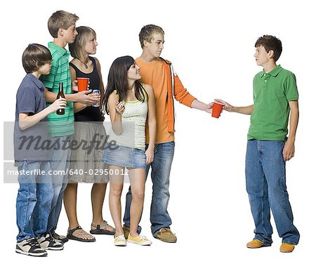 group of teenagers offering another a drink