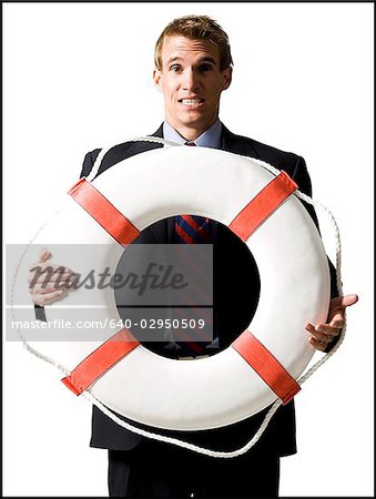 businessman holding a life preserver