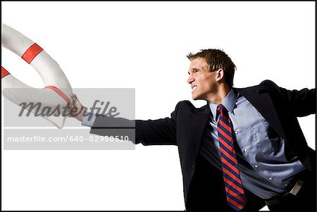 businessman holding a life preserver