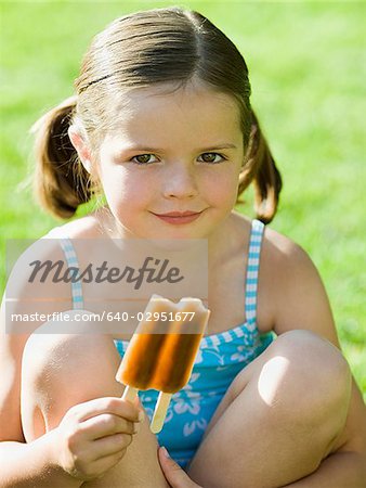 girl eating a popsicle