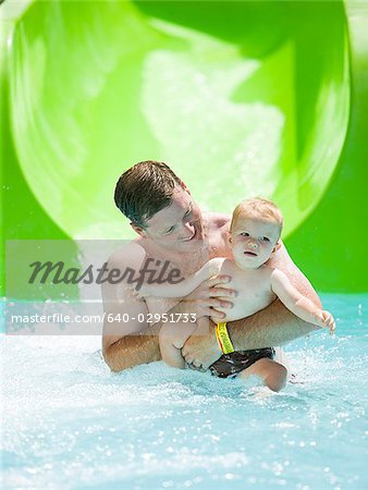 dad and son on a waterslide