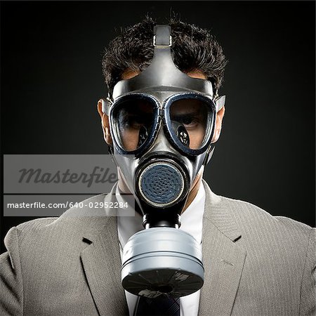 businessman wearing a gas mask