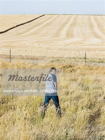 man urinating along the side of road