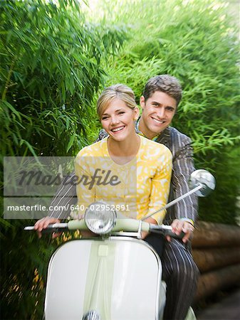 young couple on a classic motor scooter