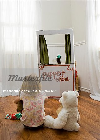 children watching a puppet show