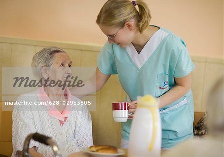 Nurse with senior woman in retirement home