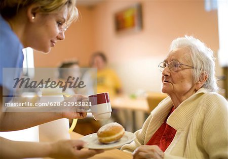 Nurse with senior woman in retirement home