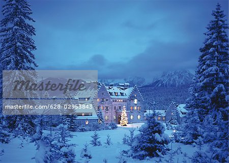 Schloss Kranzbach with Christmas tree at twilight, Werdenfels, Bavaria, Germany