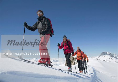 Ski mountaineers ascending mountain