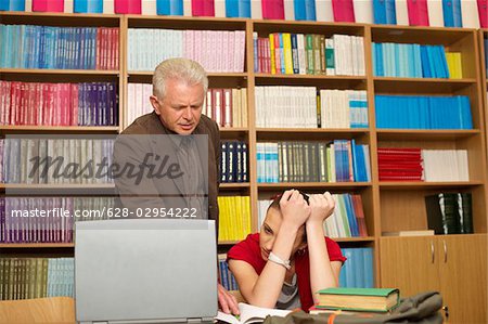 Professor helping female student