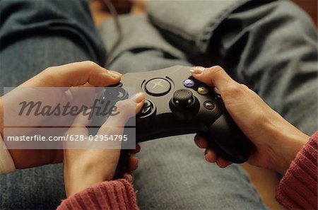 Man ashowing a Woman how to handle a Joystick - Console - Game - Entertaining