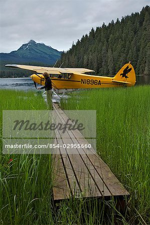 Piper Cub float plane moored on Auke Lake near Juneau, Alaska