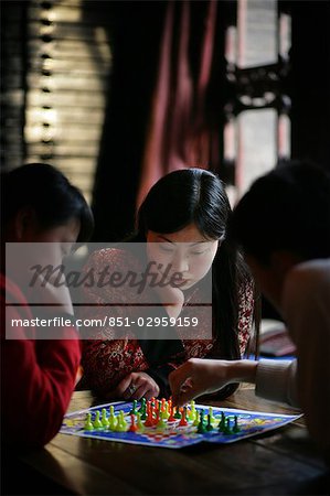 Chinese women playing the board game Chinese checkers in Pingyao,a UNESCO World Heritage Site,Shanxi Province,China