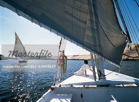 Woman on bow of felucca on River Nile,Aswan,Egypt