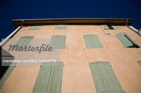 House with closed window shutters,low angle view,L'Isle sur la Sorgue,Vaucluse,Provence,France
