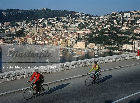 cyclists by waterfront,Riviera,France