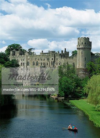 Family boating beneath Warwick Castle,Warwick,England,UK