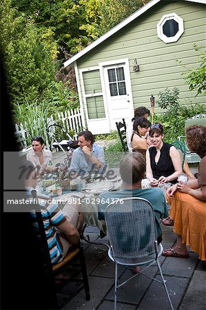 People eating dinner in back yard,Hudson Valley,New York State,USA