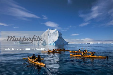 People Kayaking near Iceberg, Antarctica