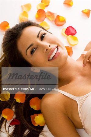 Woman Surrounded by Flower Petals