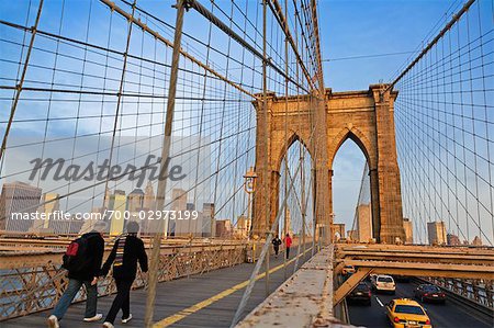 People Crossing Brooklyn Bridge, New York City, New York, USA