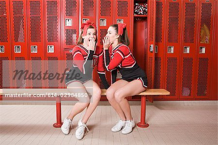 Cheerleaders gossiping in locker room