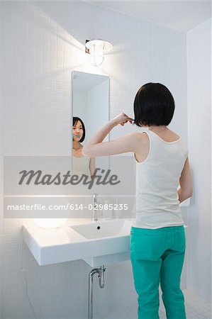 Japanese woman brushing her teeth